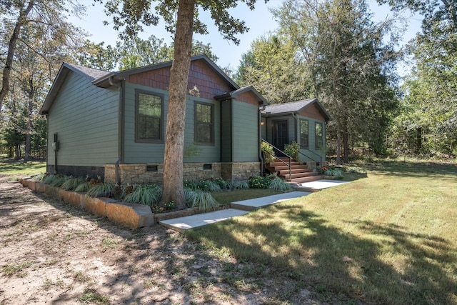 craftsman inspired home with a front lawn