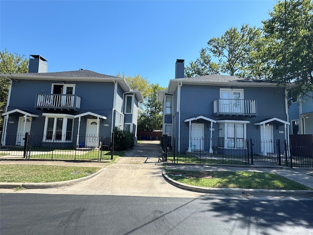 view of front property with a balcony