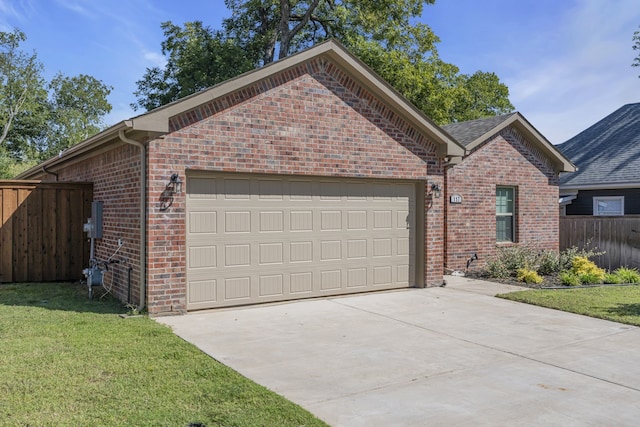 view of front facade featuring a garage and a front lawn