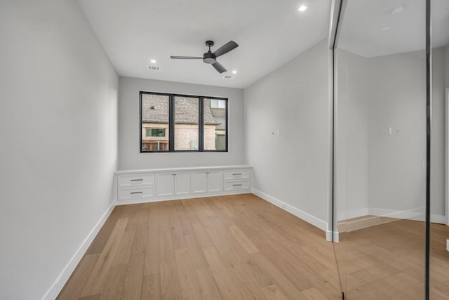 unfurnished bedroom with ceiling fan, light hardwood / wood-style flooring, and a closet