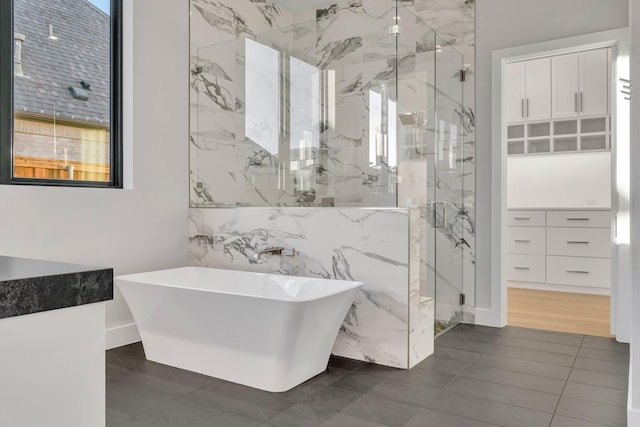 bathroom with tile patterned floors, a healthy amount of sunlight, and shower with separate bathtub