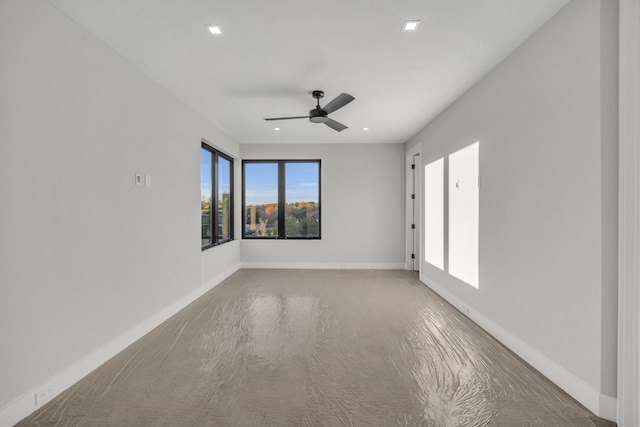 unfurnished room with ceiling fan