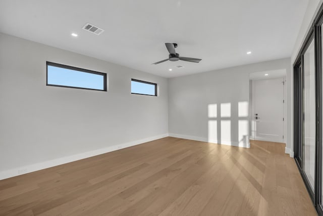 unfurnished room with ceiling fan and light hardwood / wood-style flooring