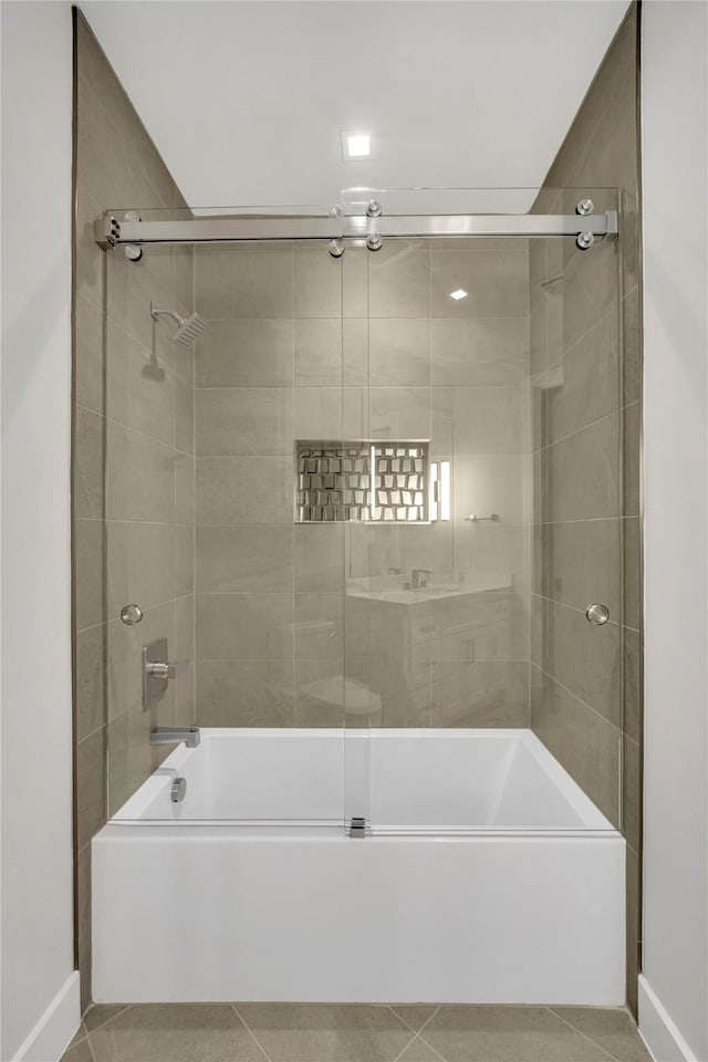 bathroom with tile patterned flooring and enclosed tub / shower combo