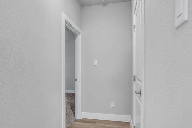 hall with light wood-type flooring