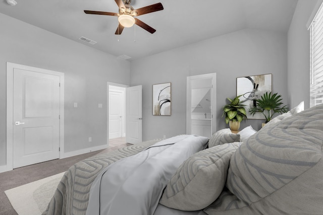 carpeted bedroom featuring vaulted ceiling, ceiling fan, and ensuite bathroom