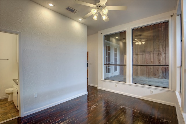 unfurnished room featuring ceiling fan and hardwood / wood-style flooring