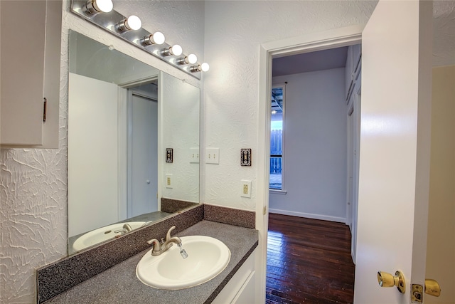 bathroom with wood-type flooring and vanity