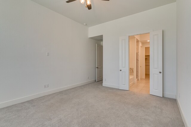 unfurnished bedroom with light carpet and ceiling fan