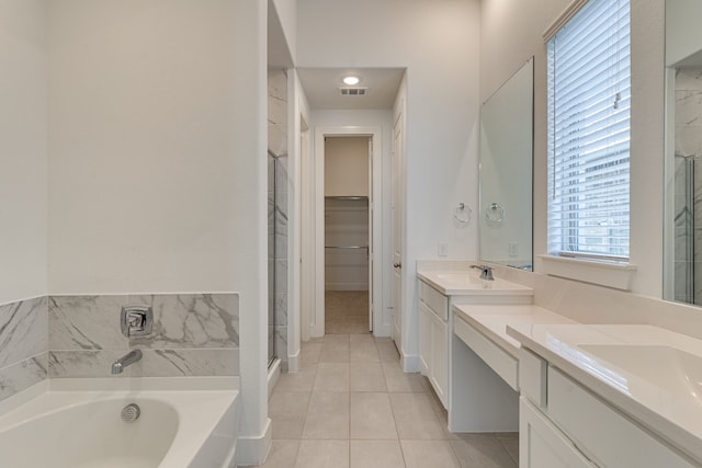 bathroom with vanity, plus walk in shower, and tile patterned floors