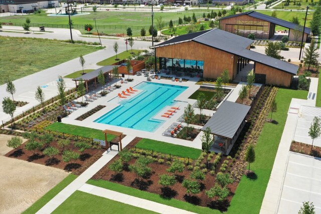 view of swimming pool with a yard and a patio area