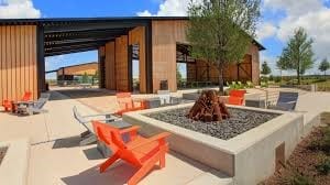 view of property's community with an outdoor fire pit and a patio area