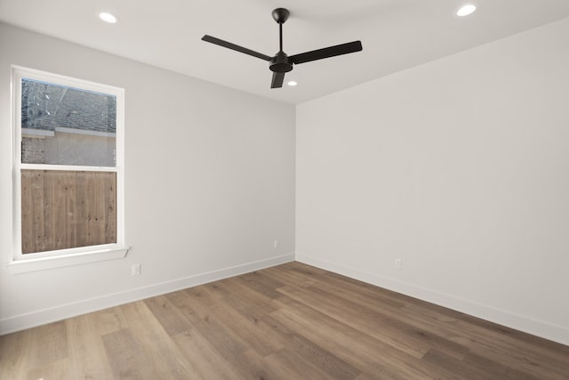 unfurnished room with ceiling fan and wood-type flooring