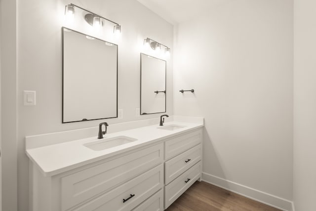 bathroom featuring vanity and hardwood / wood-style floors