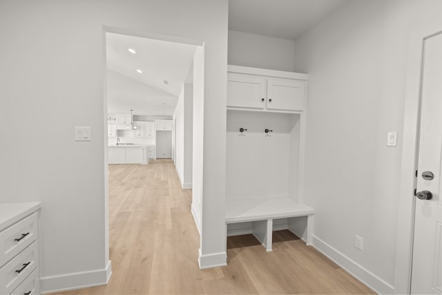 mudroom featuring sink and light wood-type flooring