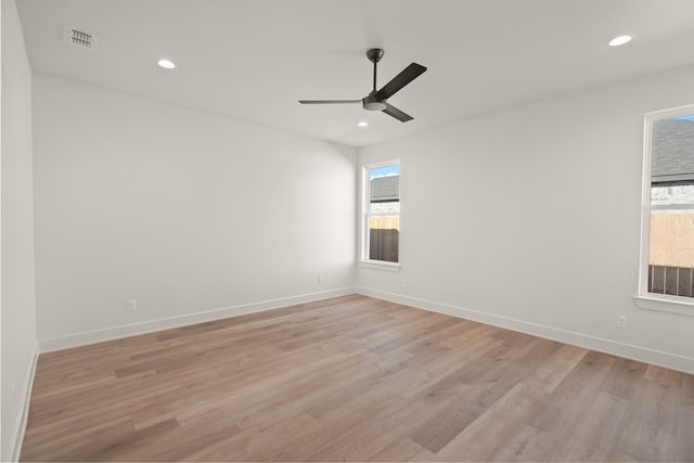 unfurnished room with ceiling fan and light wood-type flooring