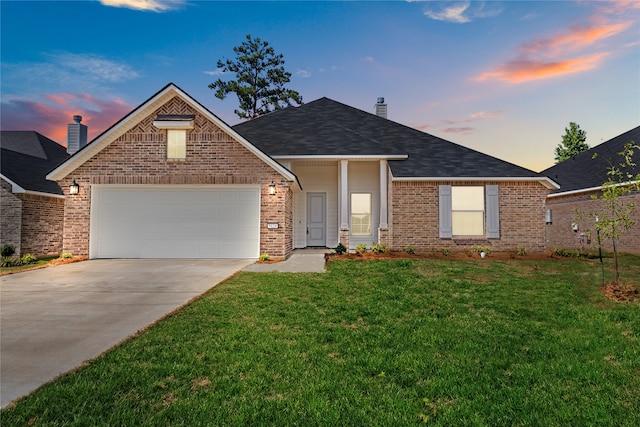 view of front of house with a lawn and a garage