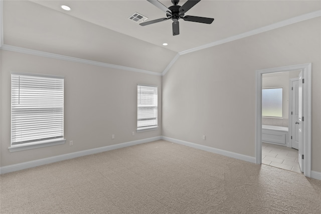 carpeted empty room with ornamental molding, lofted ceiling, and ceiling fan