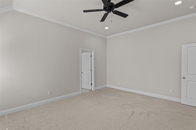 unfurnished room featuring ceiling fan, ornamental molding, and carpet flooring