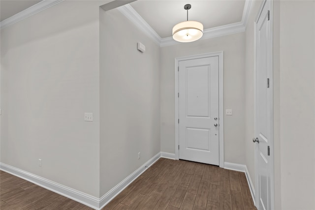 foyer with dark hardwood / wood-style floors and crown molding