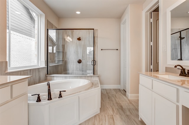 bathroom with plus walk in shower and vanity