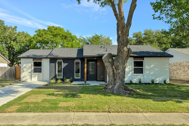 ranch-style house with a front lawn