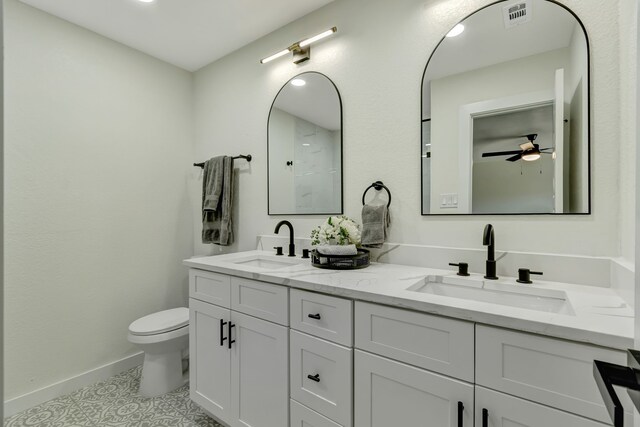 bathroom with ceiling fan, vanity, tile patterned flooring, and toilet