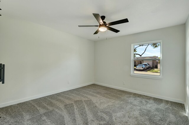 unfurnished room with ceiling fan and light colored carpet