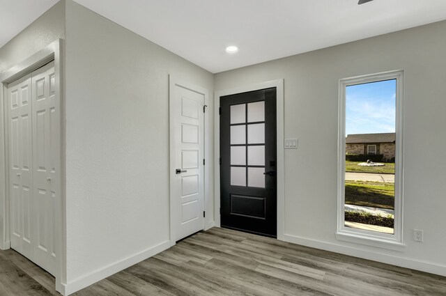 foyer entrance with light wood-type flooring