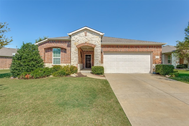 view of front of home with a garage and a front lawn