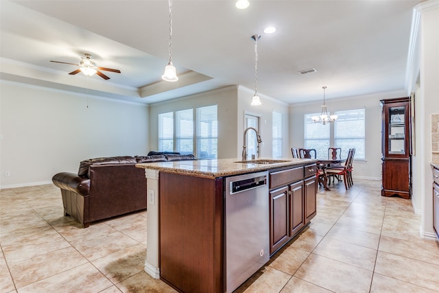 kitchen featuring stainless steel dishwasher, sink, an island with sink, and plenty of natural light