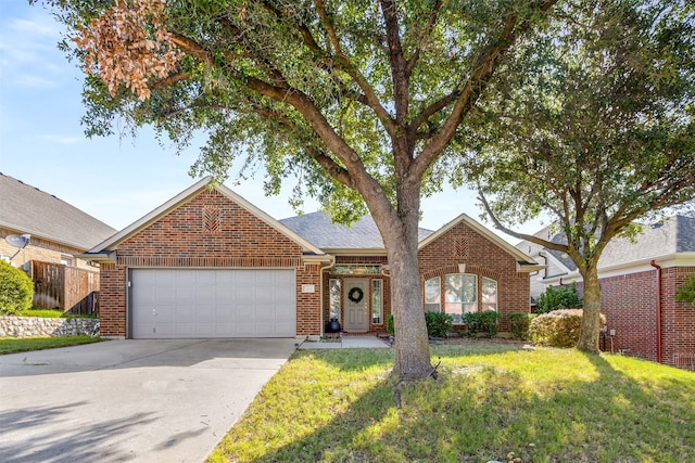 view of front facade featuring a front yard and a garage