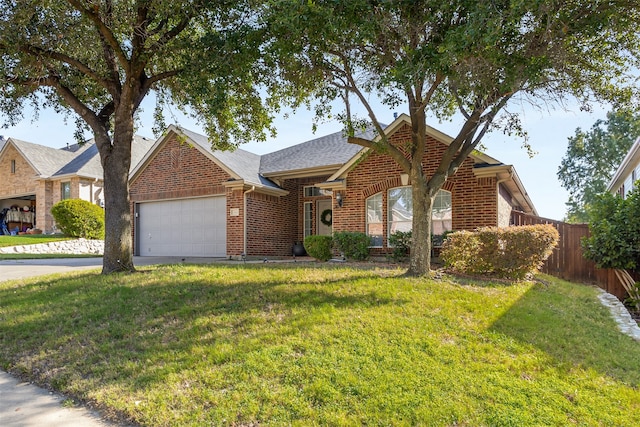 view of front facade with a front lawn and a garage