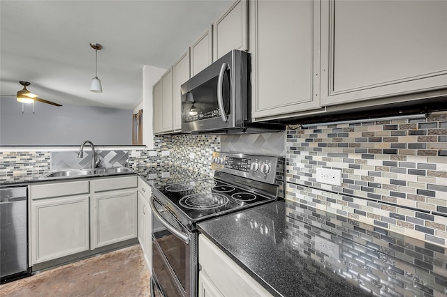 kitchen featuring appliances with stainless steel finishes, sink, hanging light fixtures, and backsplash