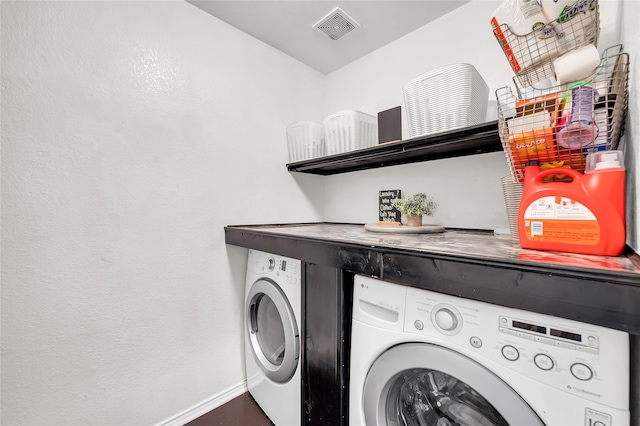 laundry room with washer and clothes dryer