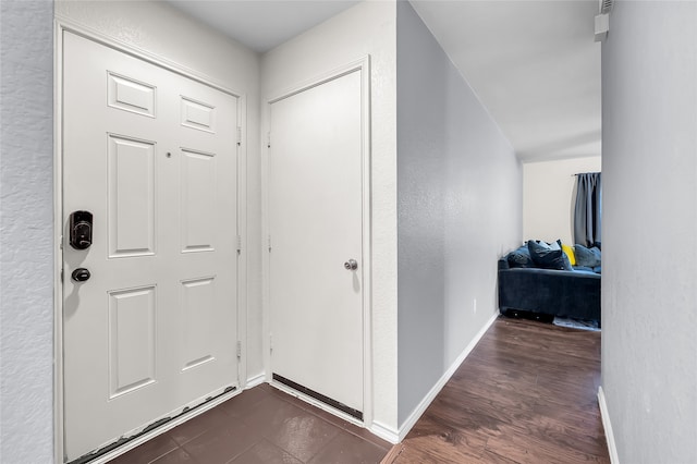 foyer with dark hardwood / wood-style flooring