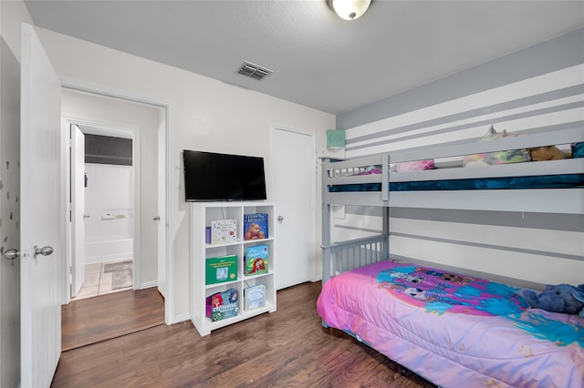 bedroom featuring dark wood-type flooring