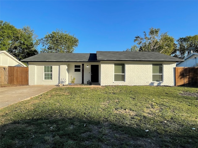 ranch-style home with a front yard