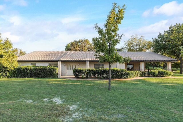 ranch-style home featuring a front yard