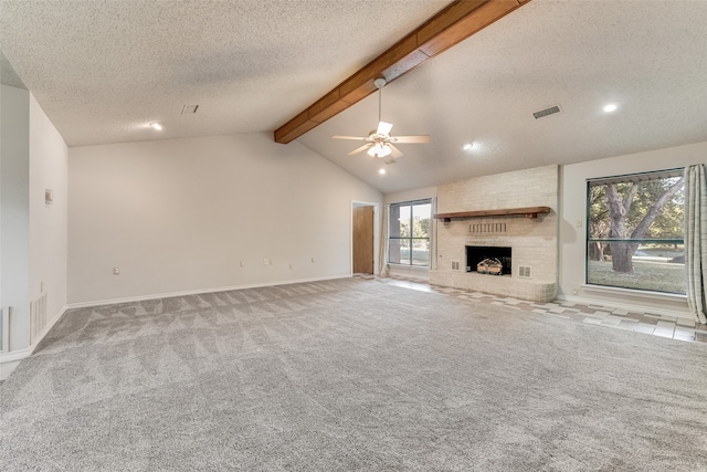 unfurnished living room featuring vaulted ceiling with beams, a brick fireplace, light colored carpet, and ceiling fan