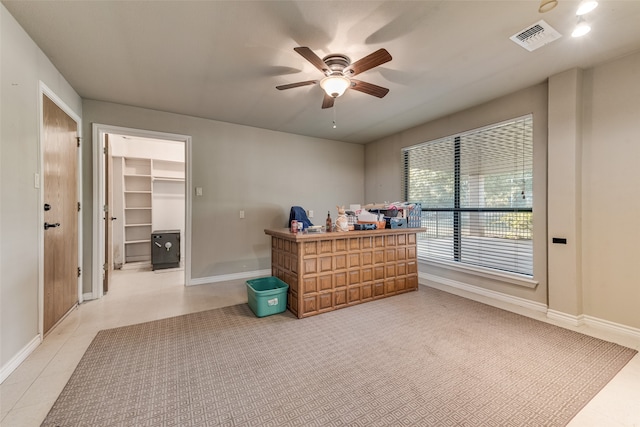 interior space featuring ceiling fan