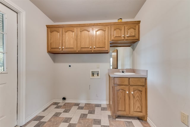 laundry area with sink, hookup for a washing machine, electric dryer hookup, and cabinets