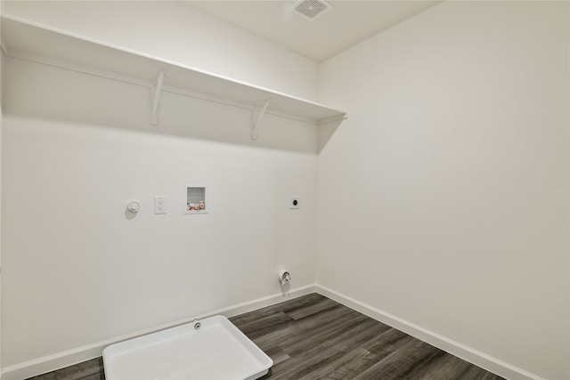 clothes washing area featuring gas dryer hookup, hookup for a washing machine, dark hardwood / wood-style floors, and electric dryer hookup