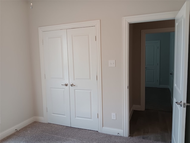 interior space featuring a closet and carpet flooring