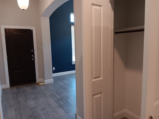 entryway with dark wood-type flooring