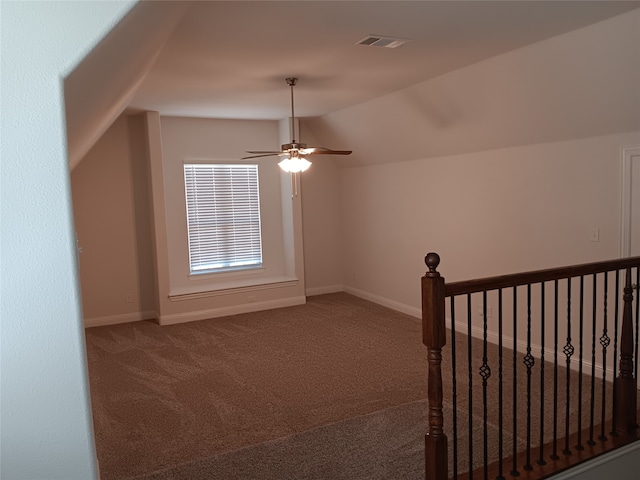 bonus room with vaulted ceiling, carpet, and ceiling fan