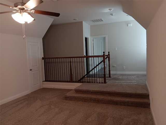 bonus room with lofted ceiling, carpet, and ceiling fan