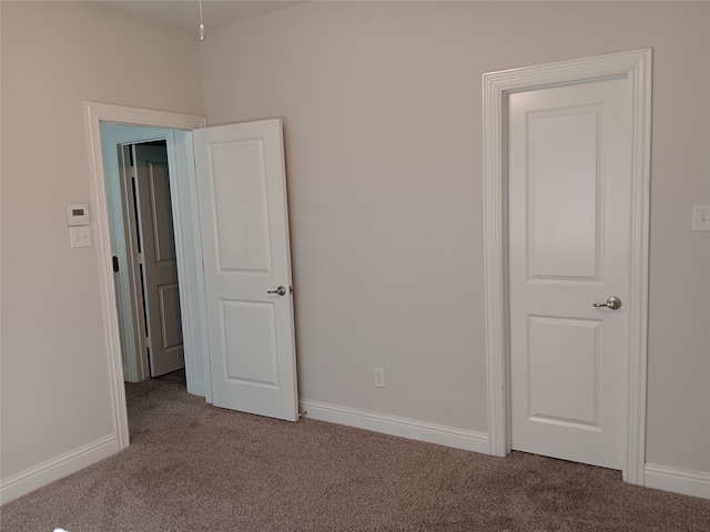 unfurnished bedroom with carpet floors