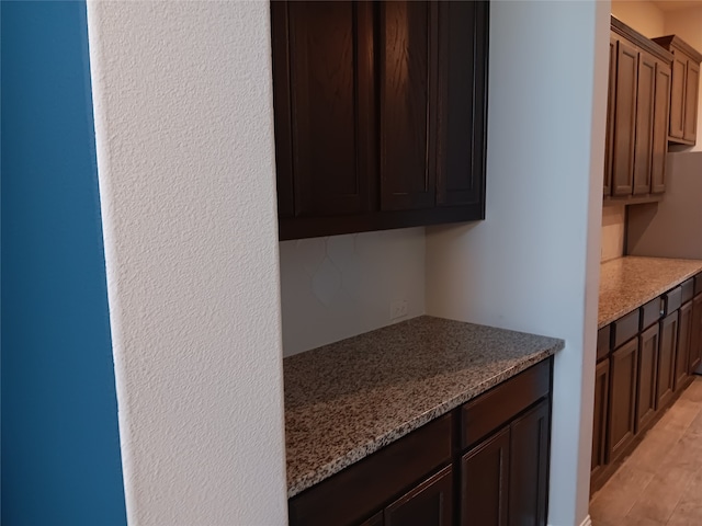 interior space featuring light stone countertops and light hardwood / wood-style floors