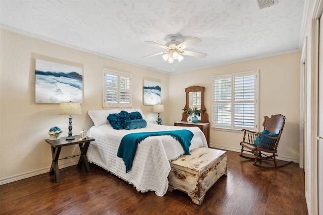 bedroom featuring ornamental molding, ceiling fan, dark hardwood / wood-style floors, and a textured ceiling